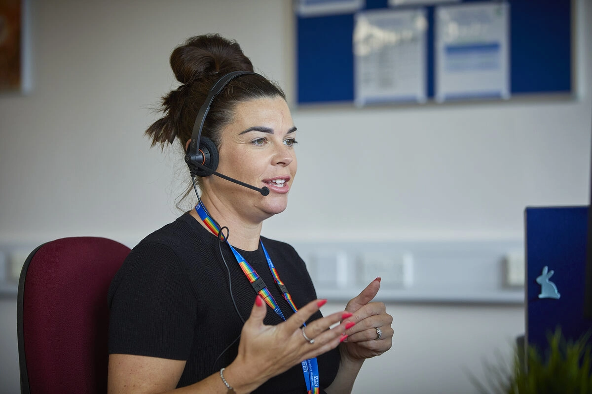 Staff Using Headset at computer screen