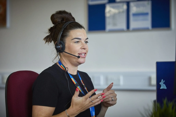 Staff Using Headset at computer screen